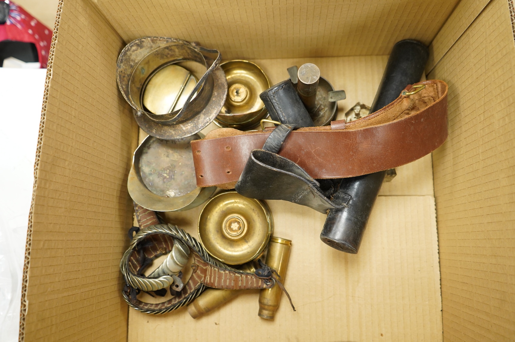 A collection of militaria, etc. including; a Gordon Highlander’s kilt and sporran, three early 20th century Union Flags, a Victorian beaded ‘sweetheart’s’ cushion, two empty First World War Princess Mary Christmas tins,